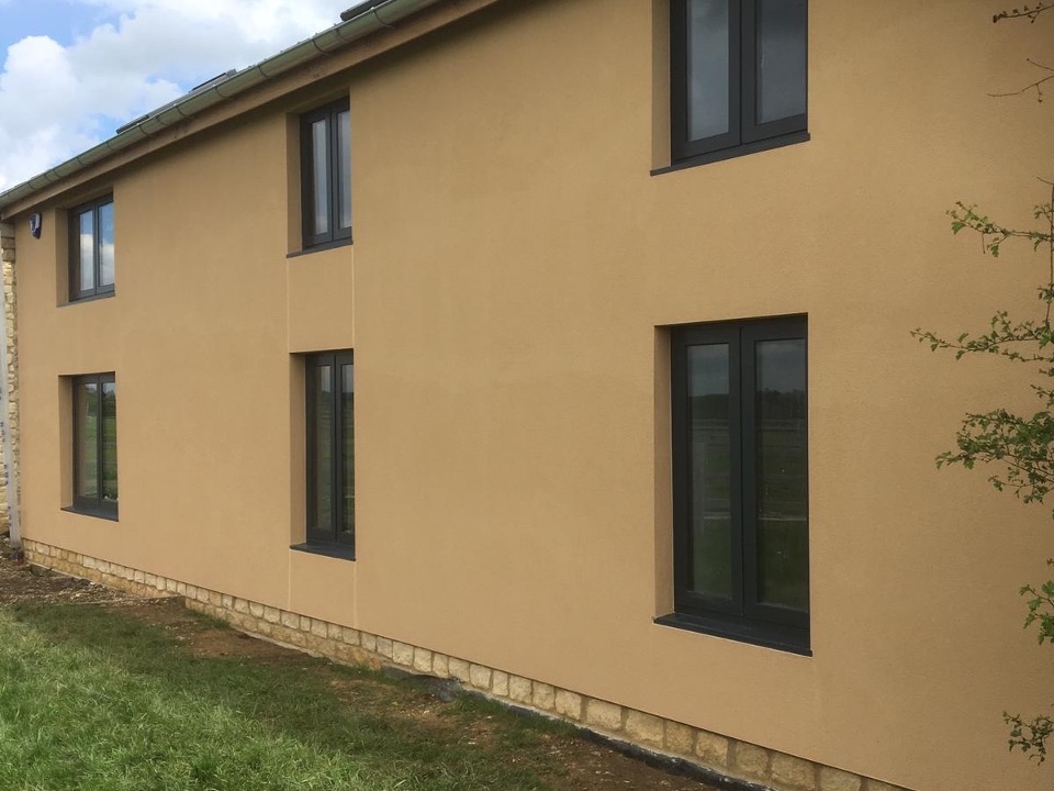 Parex EWI system project in Hanslope on a rendered residential property with dark windows and a smooth exterior finish.