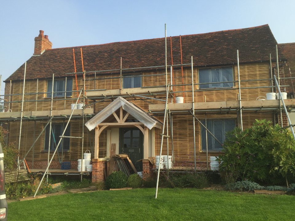 Lath and lime plastering project in Ampthill on a period property with scaffolding across the front elevation.