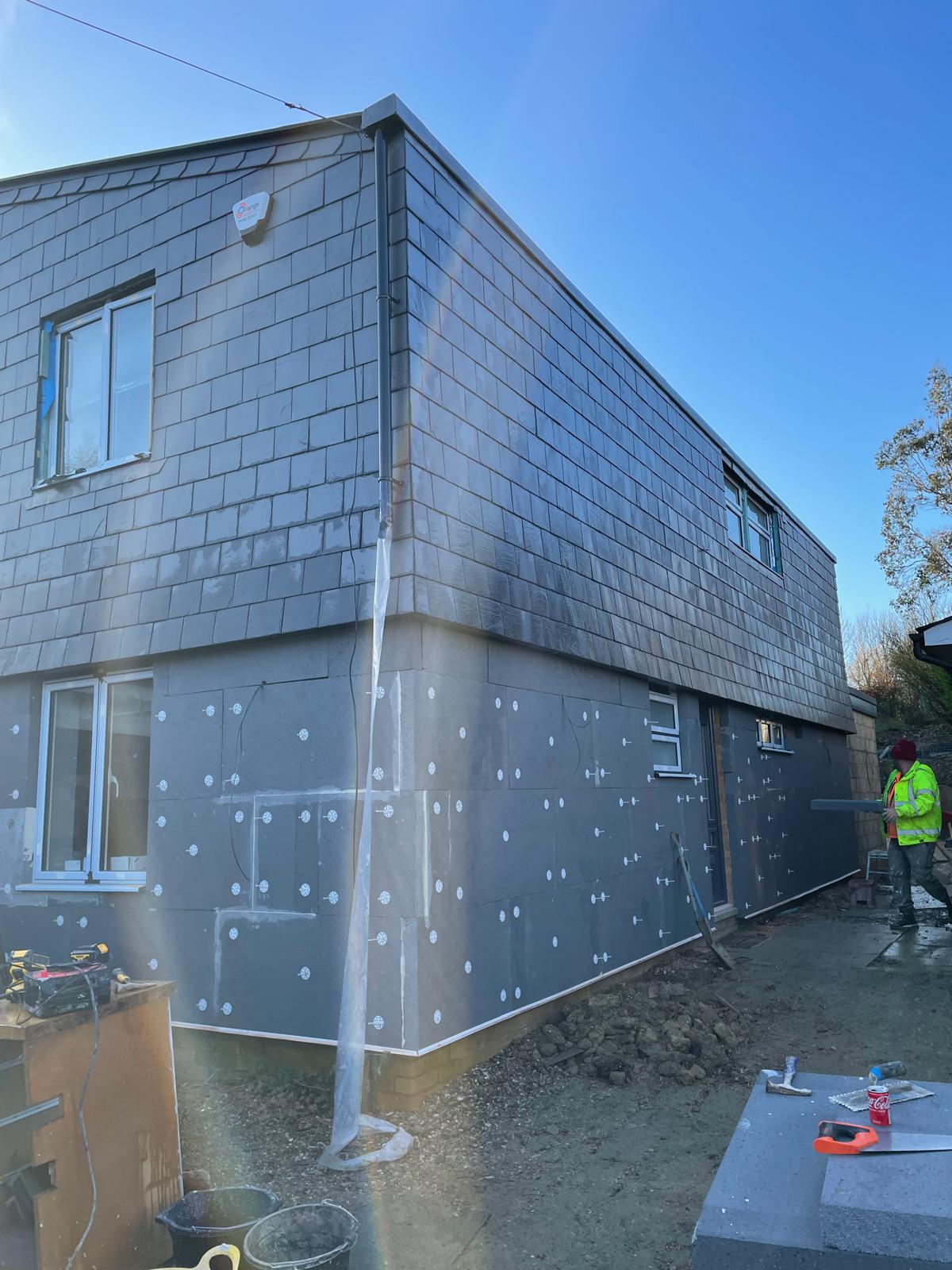 Parex EWI system installation in Little Staughton with insulation boards fixed to the exterior walls of a residential property.